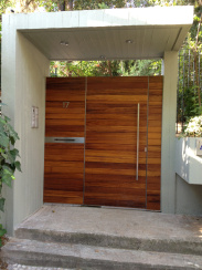 Stainless steel door with iroko wooden casing